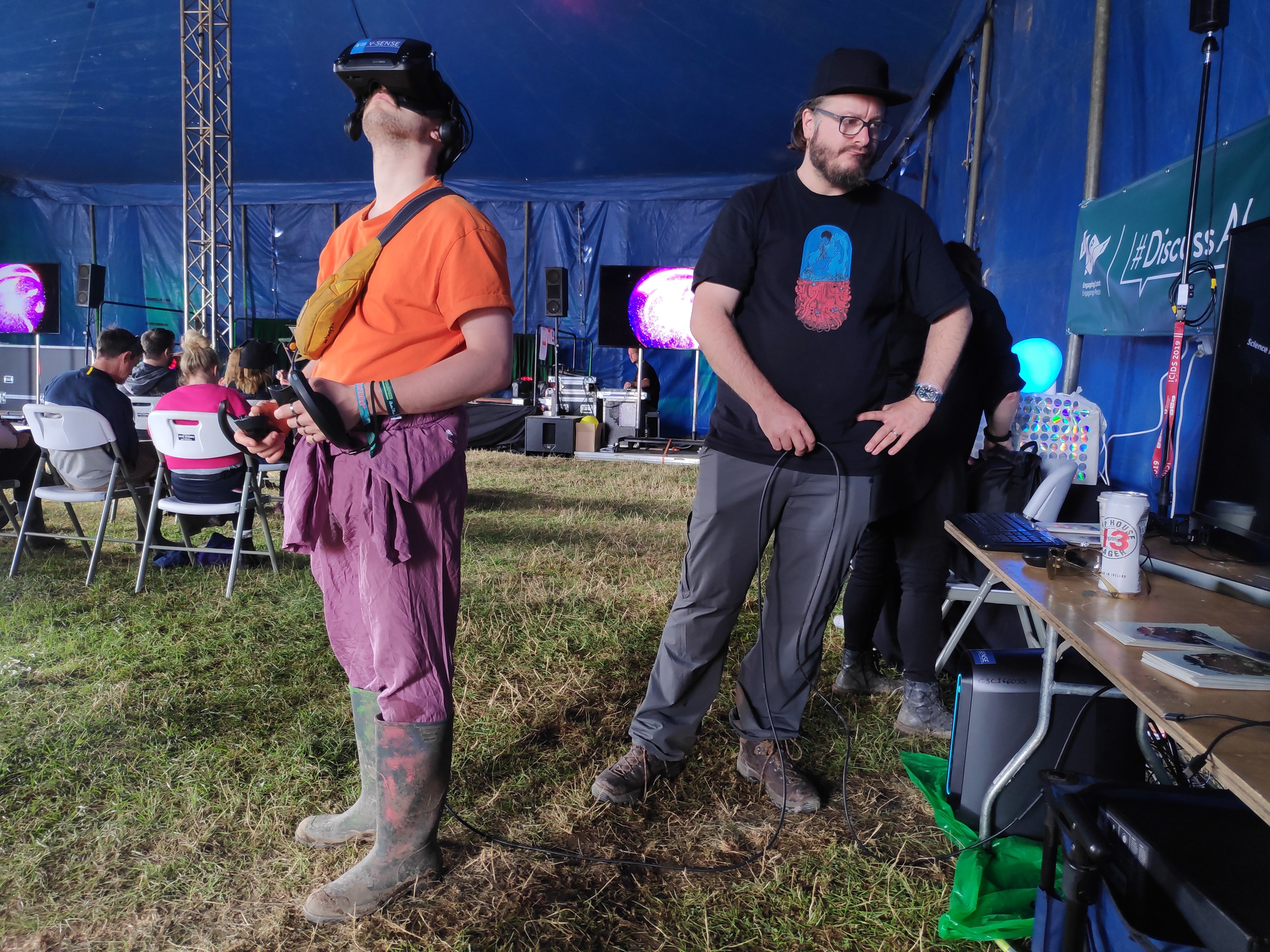 A festival goer participates in an interactive virtual reality music video exprience using volumetric video