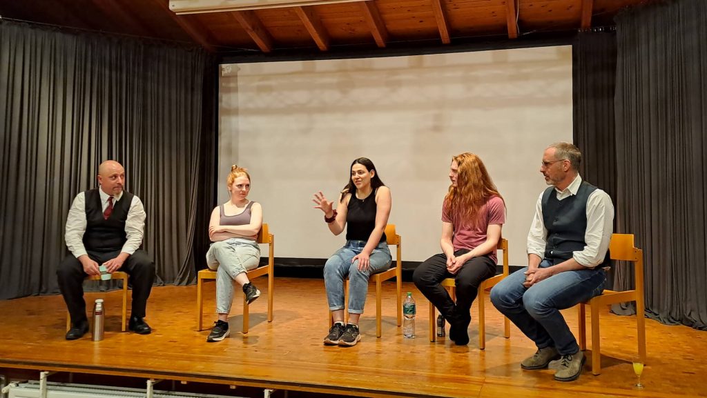 Photo of all four actors engaging in dialogue with the audience about the text using the ’hot-seat’ method to isolate each character