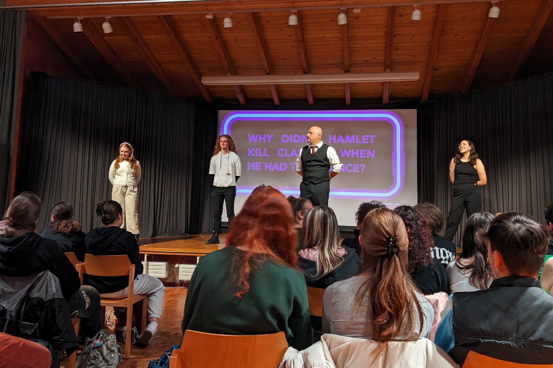 Photo of all four actors engaging in dialogue with the audience about the text using leaving cert question prompts