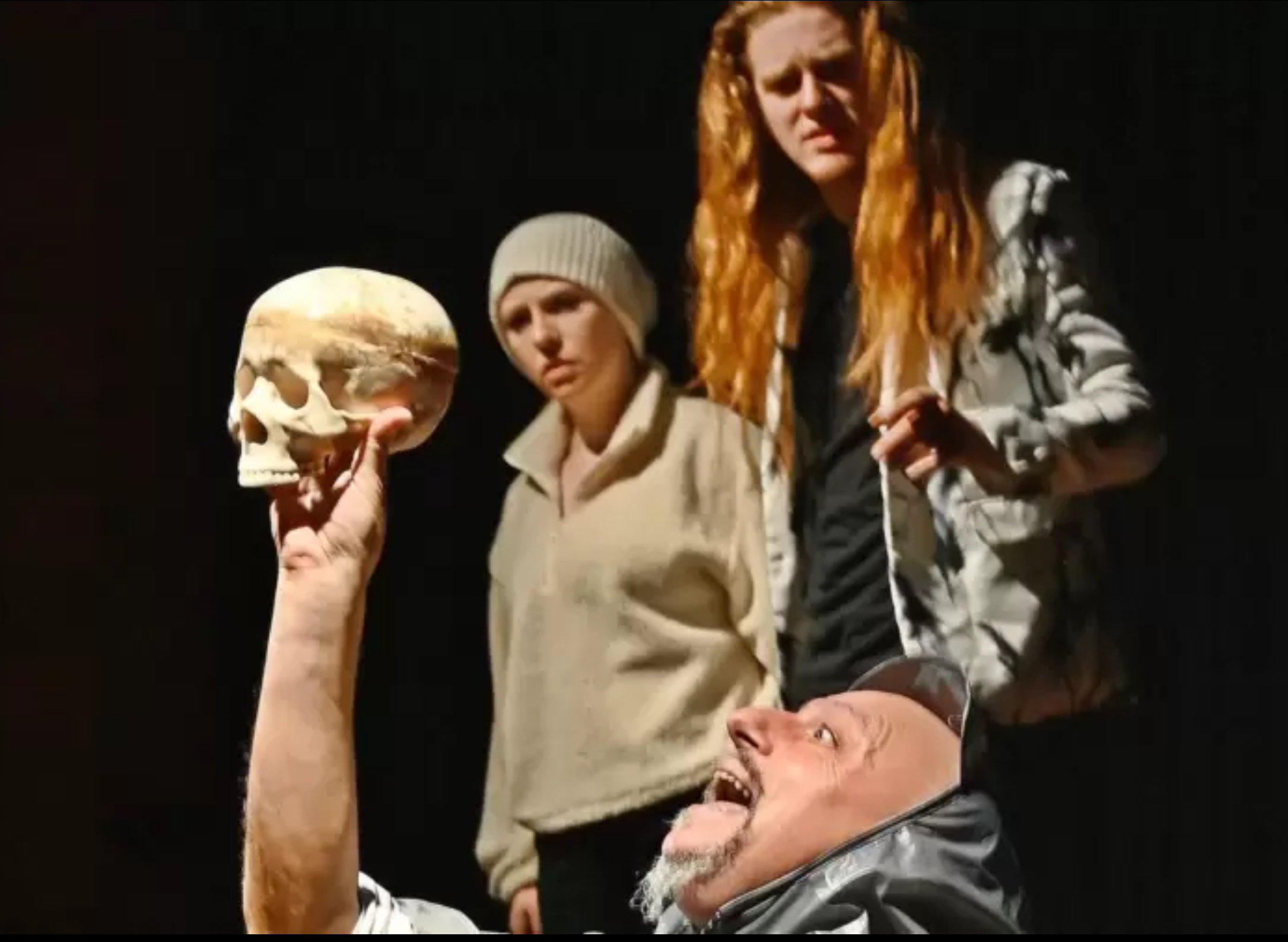 Photo of the scene in which the gravediggers uncover Yorick’s skull in front of Hamlet and Horatio