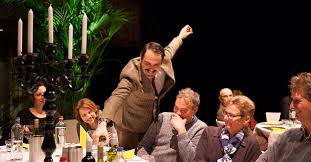 Basil Fawlty  pouring wine for guest/audience member