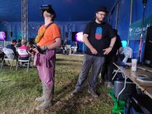 A festival goer participates in an interactive virtual reality music video exprience using volumetric video